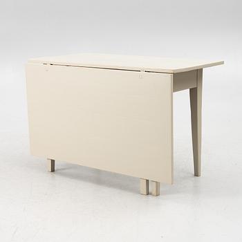 A drop-leaf table, late 19th century.