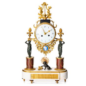 125. A late Gustavian marble and ormolu portico mantel clock, late 18th century.