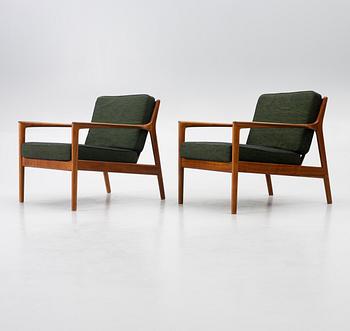 Folke Ohlsson, a pair of 'USA 75' armchairs, Dux, Sweden, 1960's.