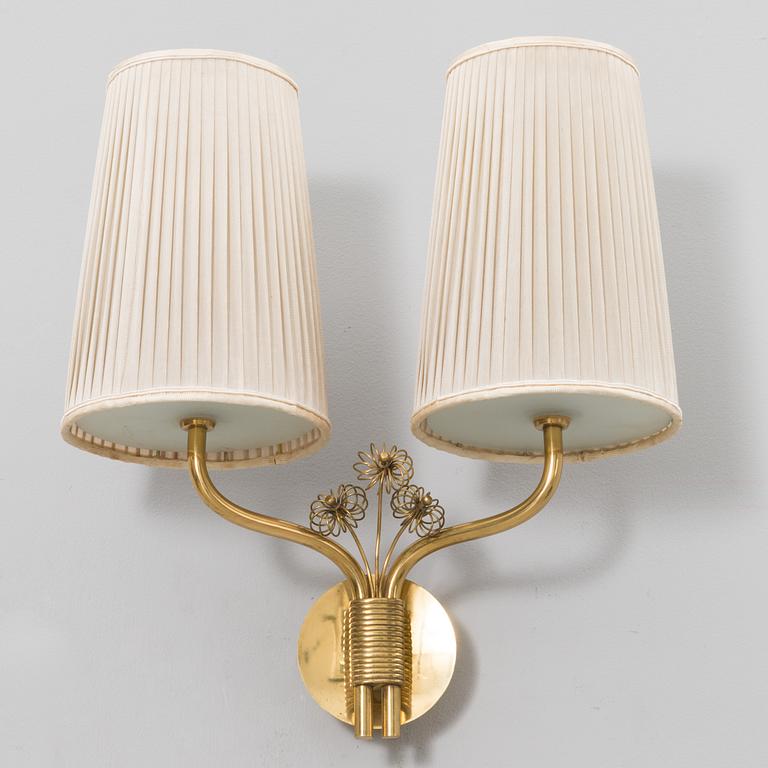 A mid-20th century wall light model 9446 for Taito, Finland.