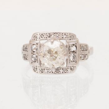 An 18K white gold ring set with an old cut diamond and rose cut diamonds.