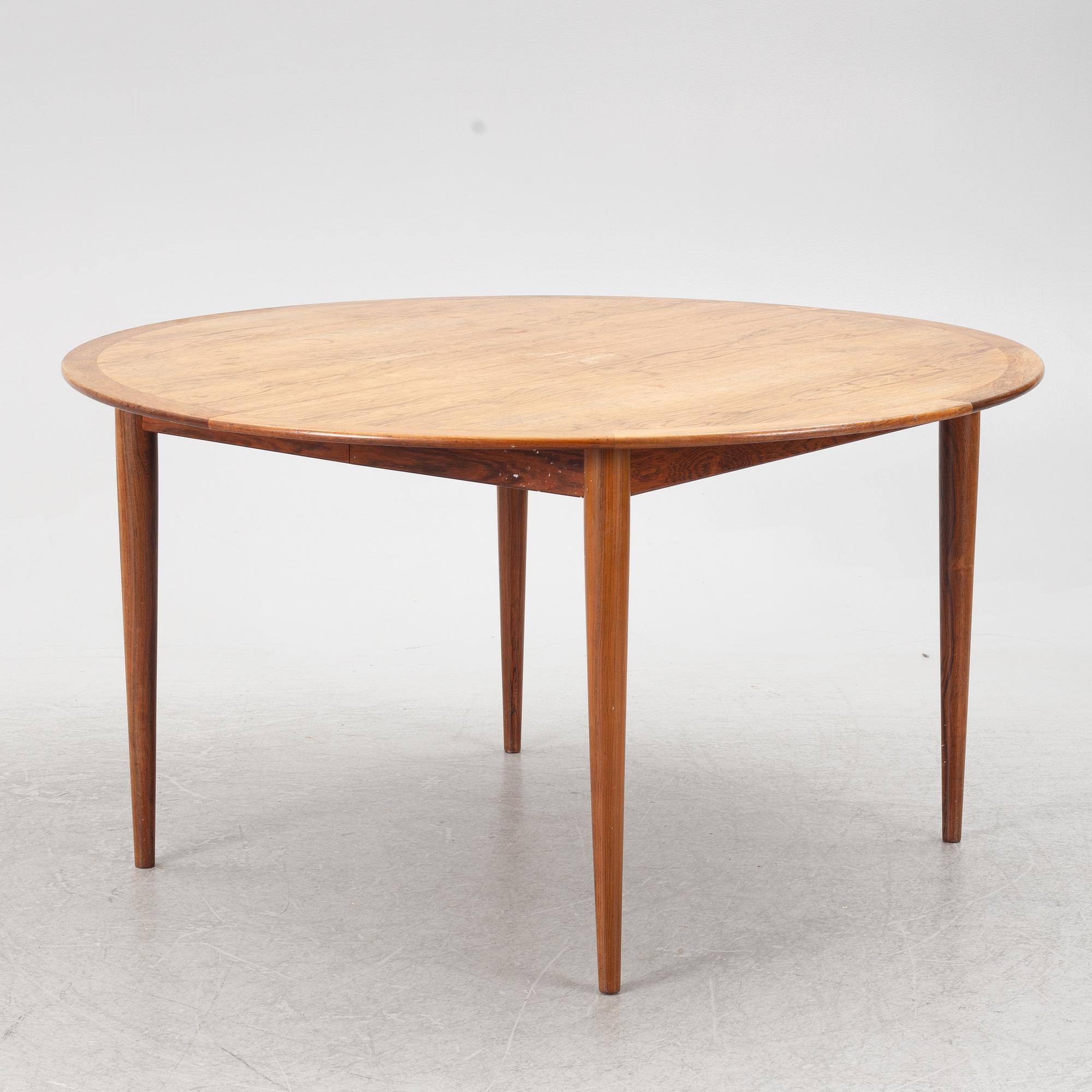 Niels Otto Møller, a rosewood dining table and eight rosewood chairs, Poul Jeppesen & JL Möller, Denmark, 1960's.