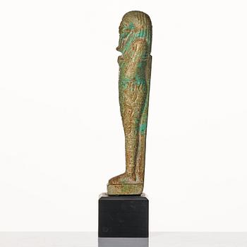 A light green pottery Ushabti Egypt presumably 26:e dynasty ca 650 B.C.