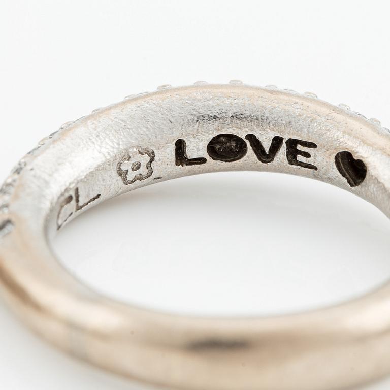 Ole Lynggaard two "Love" rings no. 4 in 18K white gold with round brilliant-cut diamonds.