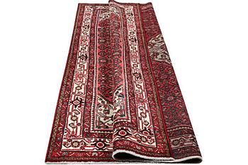 A Hosseinabad carpet, c. 310 x 210 cm.