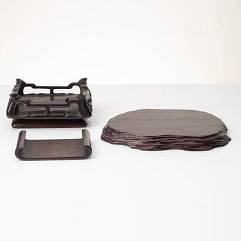 A group of Chinese hardwood stands and a cover, Qing dynasty and later.