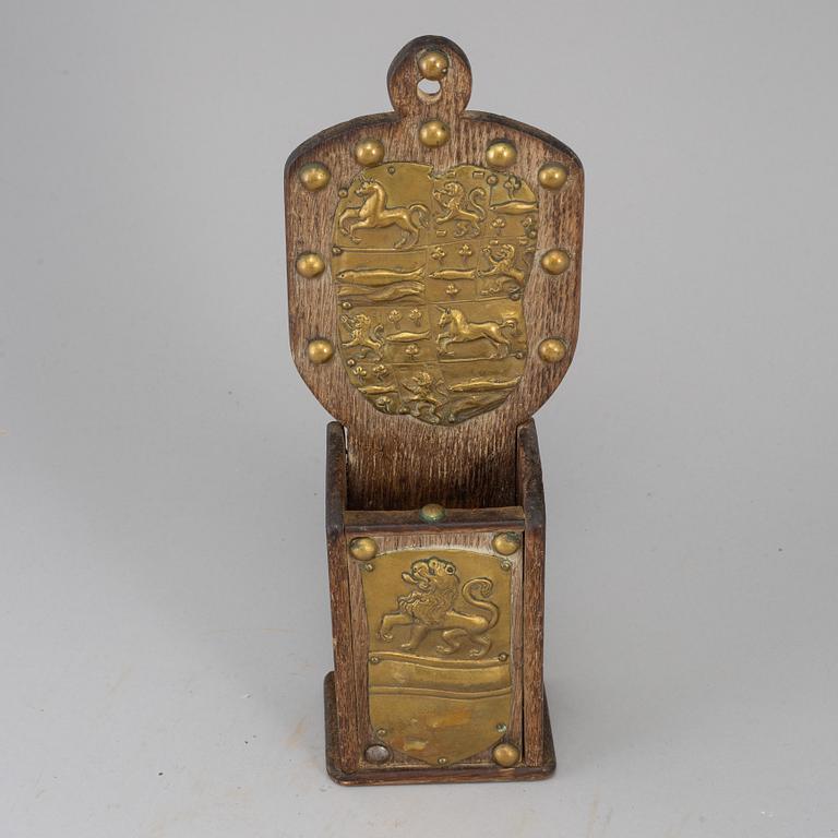 An 18th century brass and oak cutlery holder.