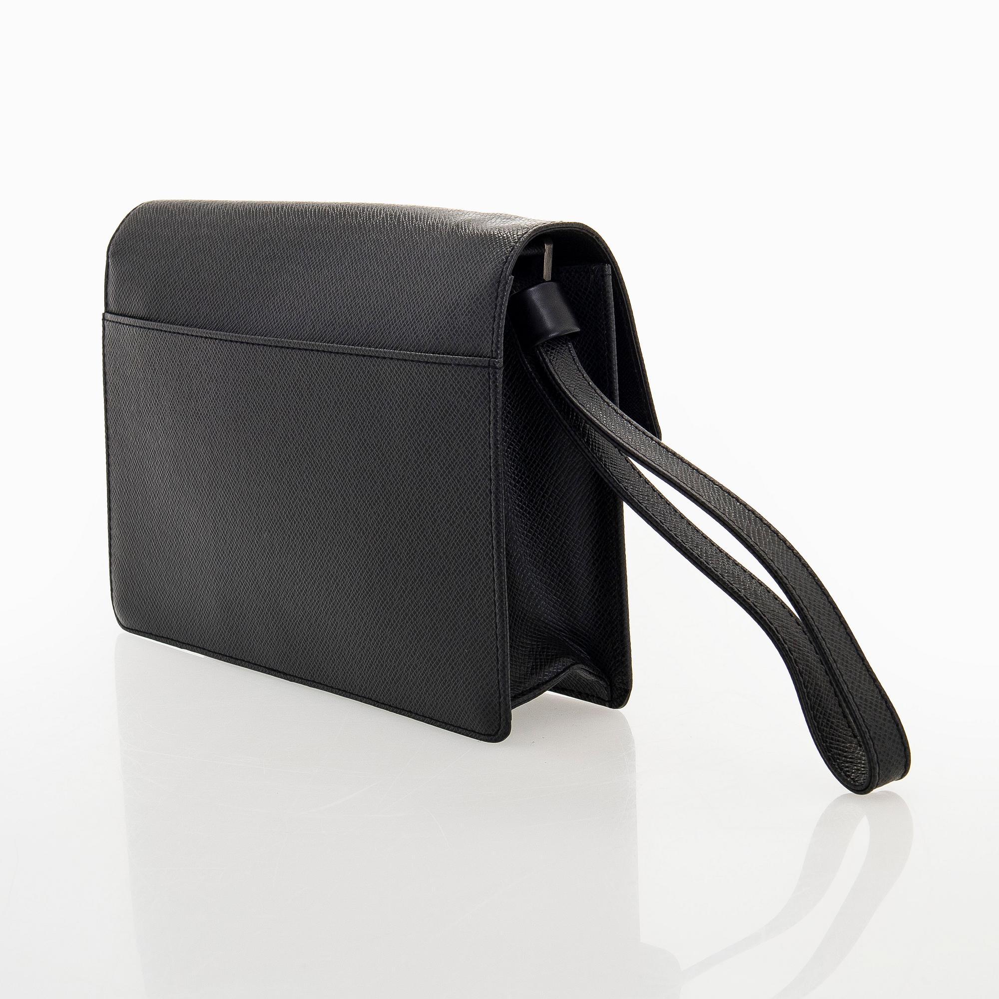 Louis Vuitton, a 'Selenga' clutch bag.