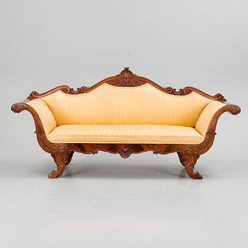 A mid 1800s mahogany sofa.