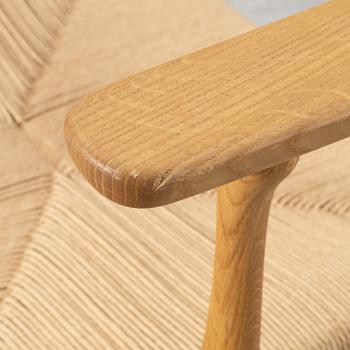 Hans J. Wegner, a CH26 chair, Carl Hansen & Son, Denmark, 21st century.