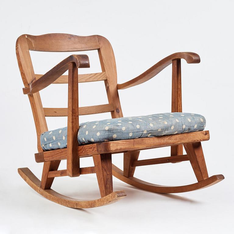 "Sportstugemöbel", a stained pine rocking chair, Nordiska Kompaniet Sweden 1930-40's.