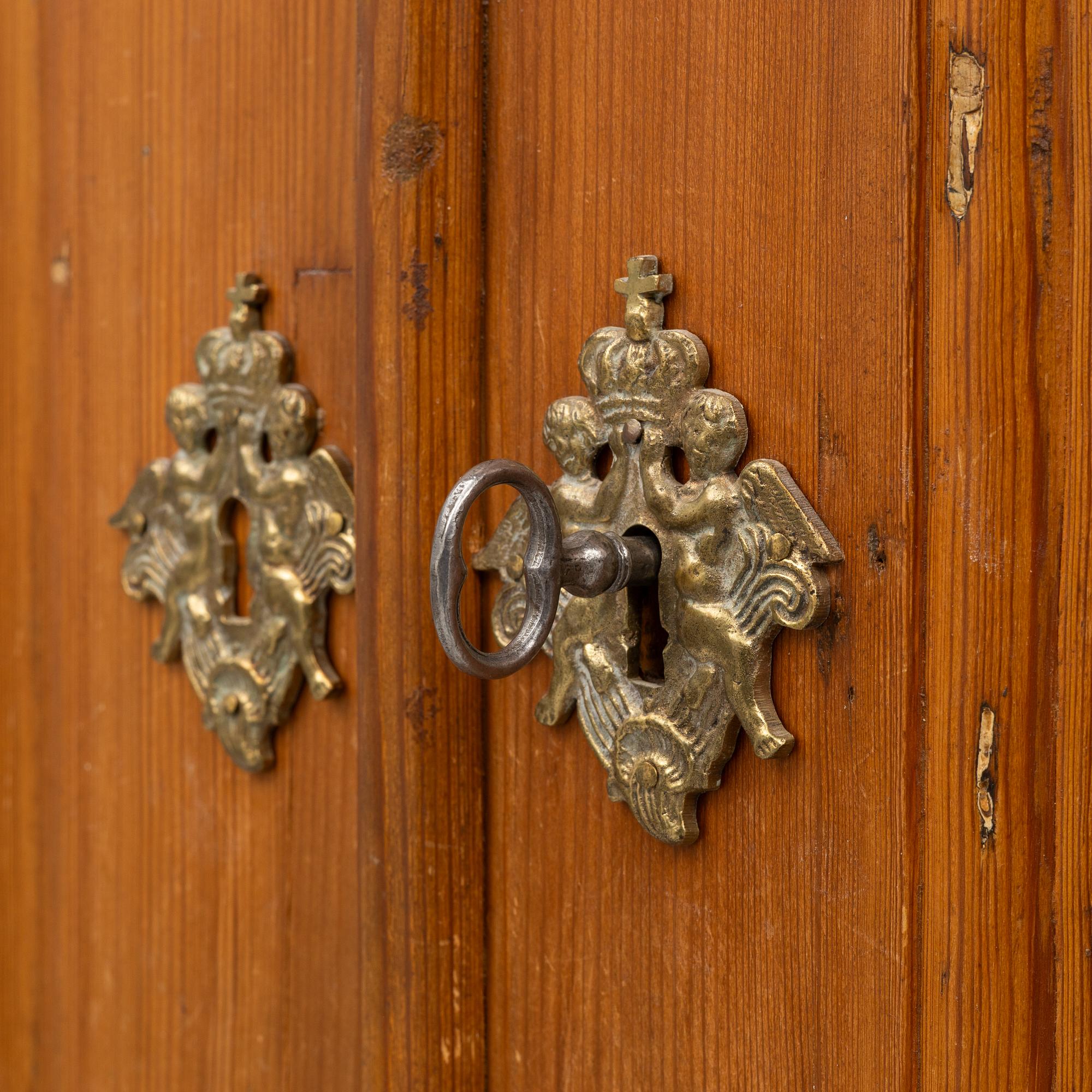 An 18th two-part pine century cabinet.