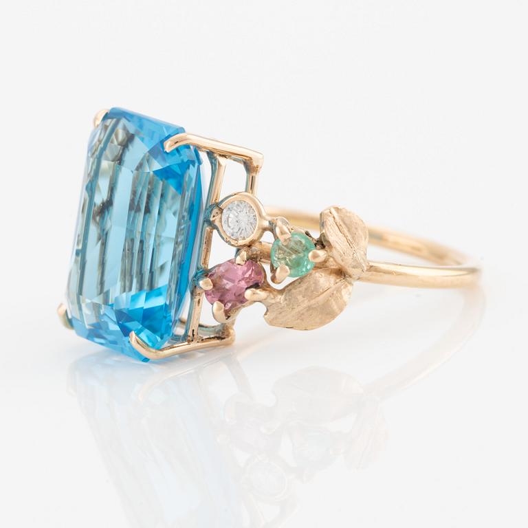 Ring, cocktail ring with large blue topaz, tourmalines, emeralds, and brilliant-cut diamonds.