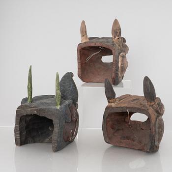 Four Tibetan/South East Asian wooden decorations, 20th century.