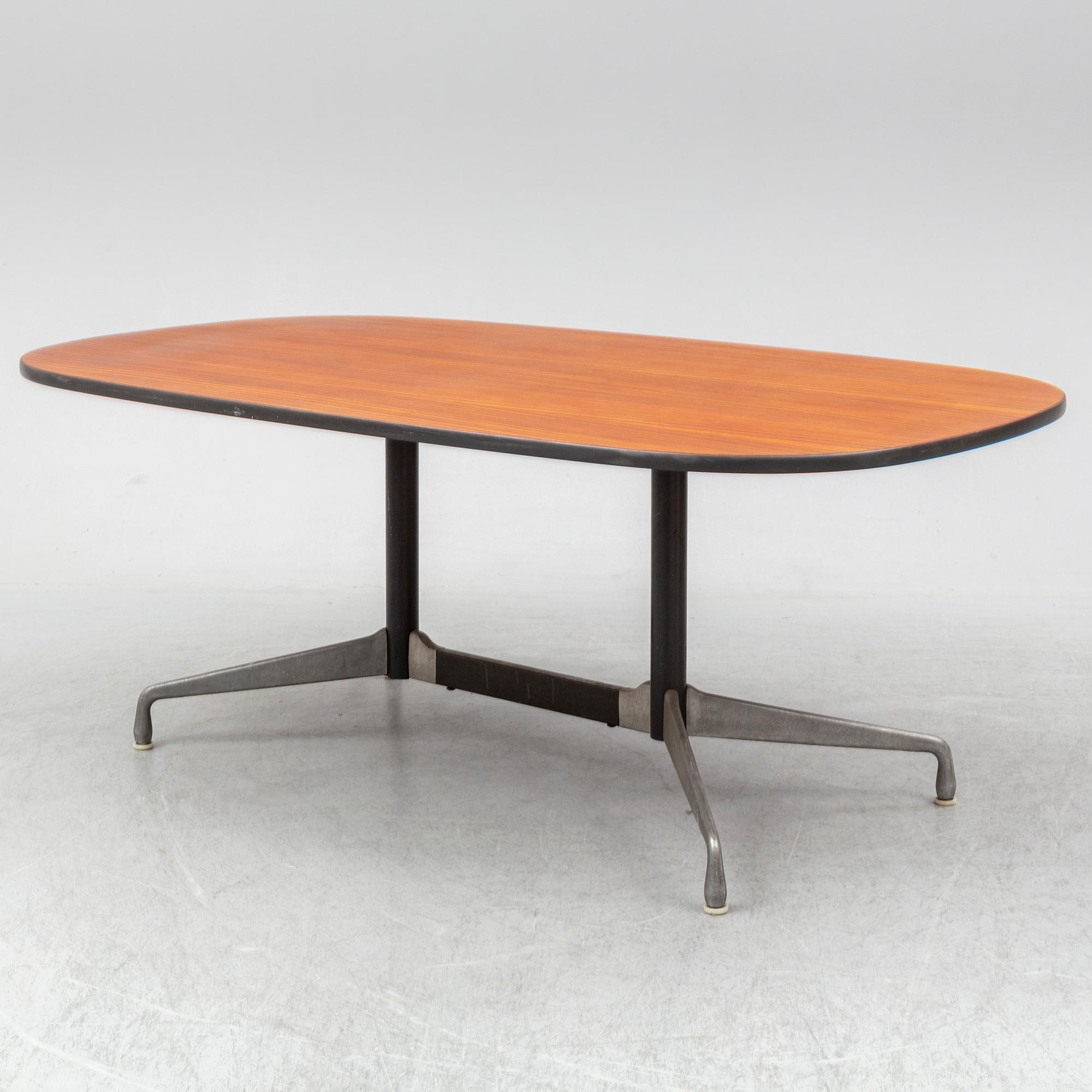 CHARLES AND RAY EAMES, a mahogany veneered table, Herman Miller.