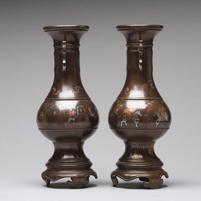 A pair of bronze vases with copper and silver inlay, Qing dynasty (1664-1912).