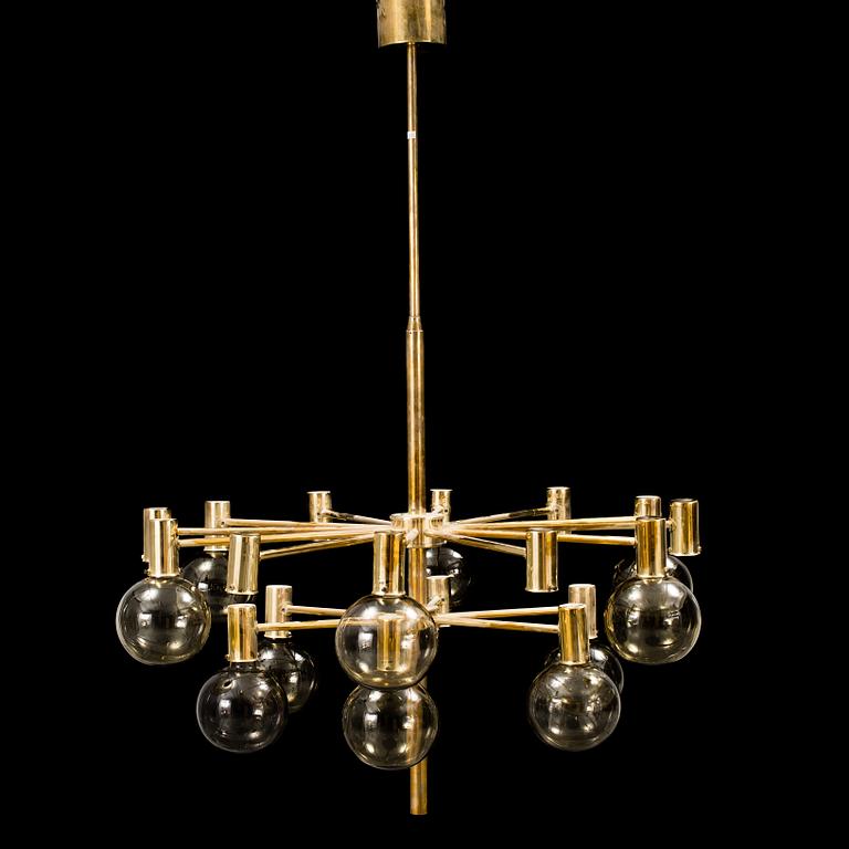 A 20th century brass and smoked glass chandelier by Hans Agne Jakobsson, Markaryd, Sweden.