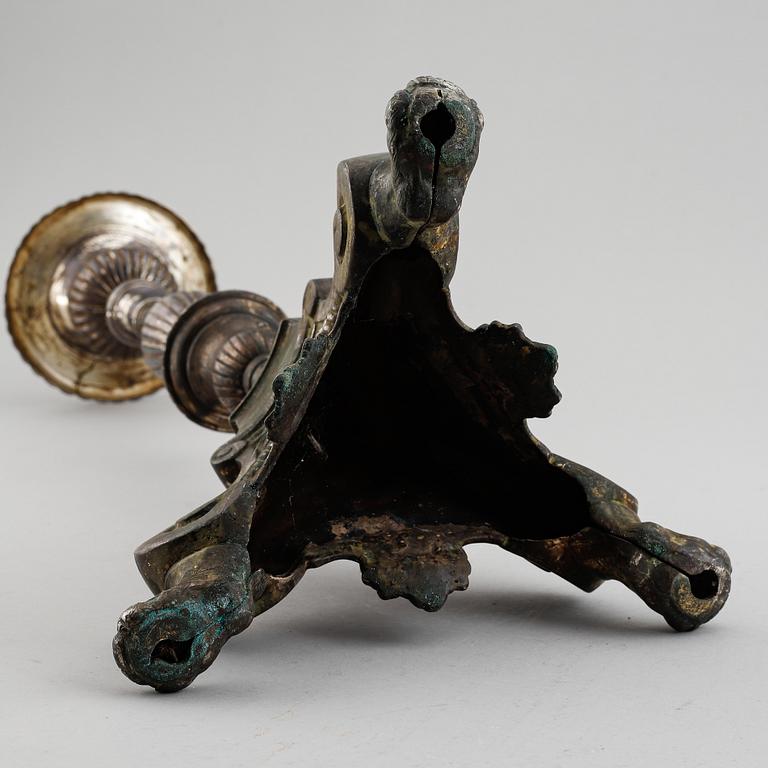 An 18th century bronze candlestick.