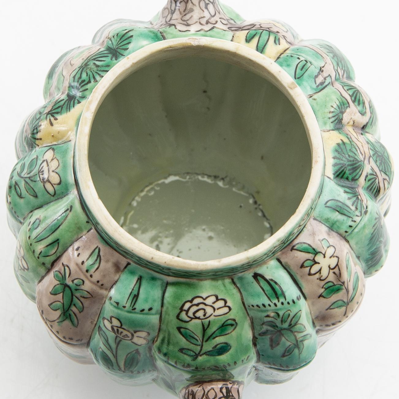 A set of three differently decorated tea pots with covers, Qing dynasty, 18century and 20th century.