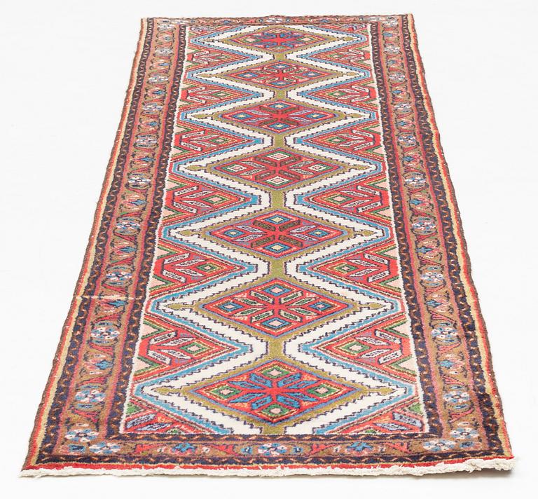 An oriental runner, c. 280 x 75-79 cm.