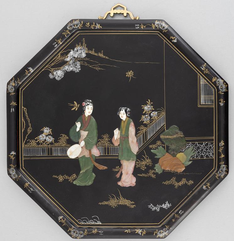 Four black-lacquered wall decorations, China, around 1900.