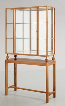 A Josef Frank cherrywood showcase cabinet, Svenskt Tenn, model 2077.