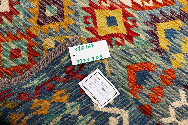 An Afghan kelim carpet, c. 397 x 308 cm.