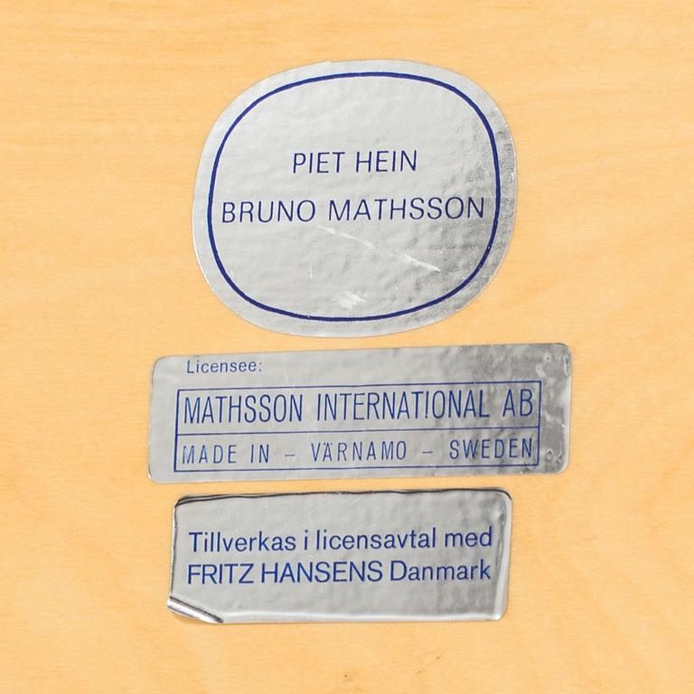 An end of th 20th century coffee table by Bruno Matsson & Piet Hein.