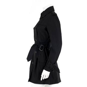 BURBERRY, a black cottonblend ladies trenchcoat. UK size 10.
