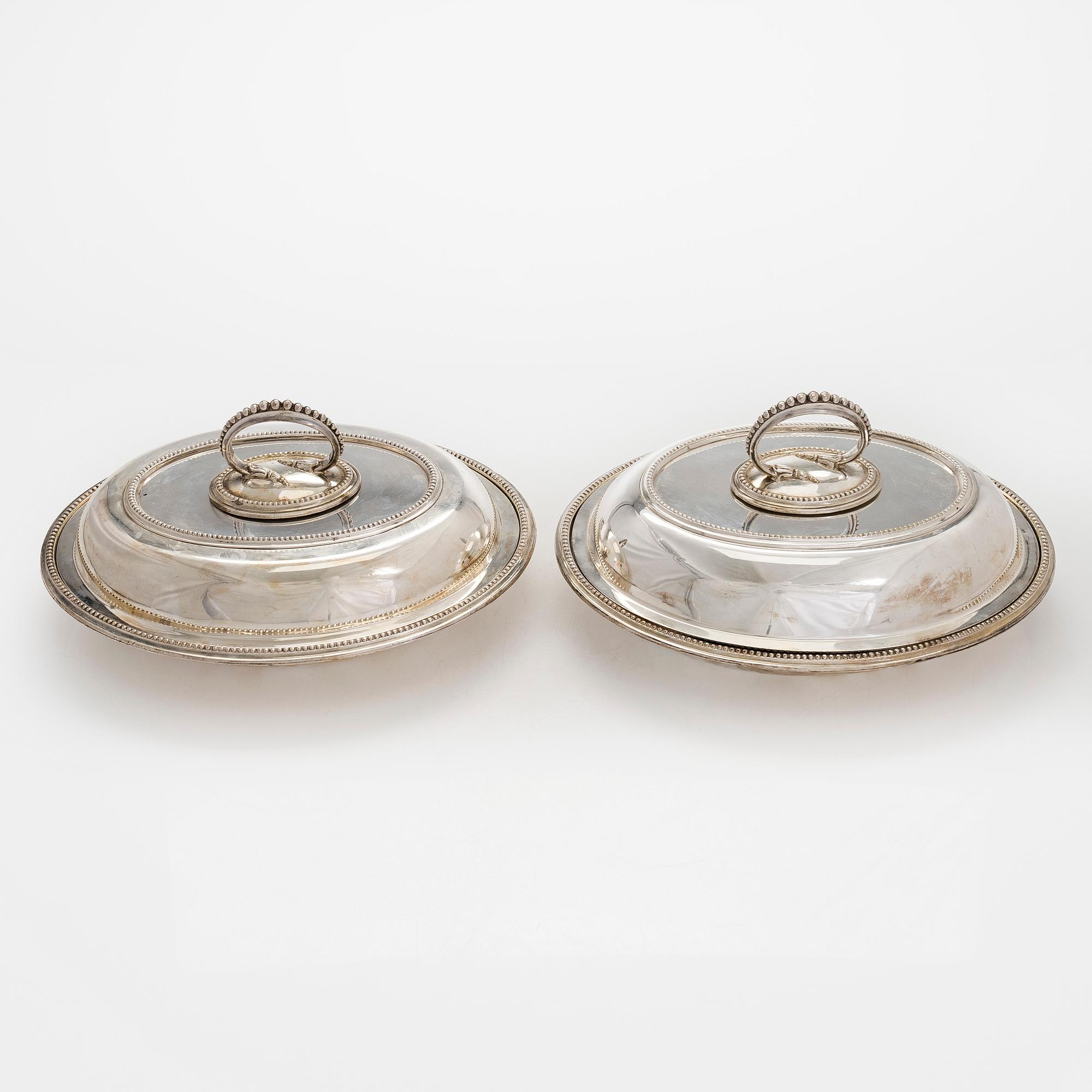 A set of four silver plated entree dishes, England.
