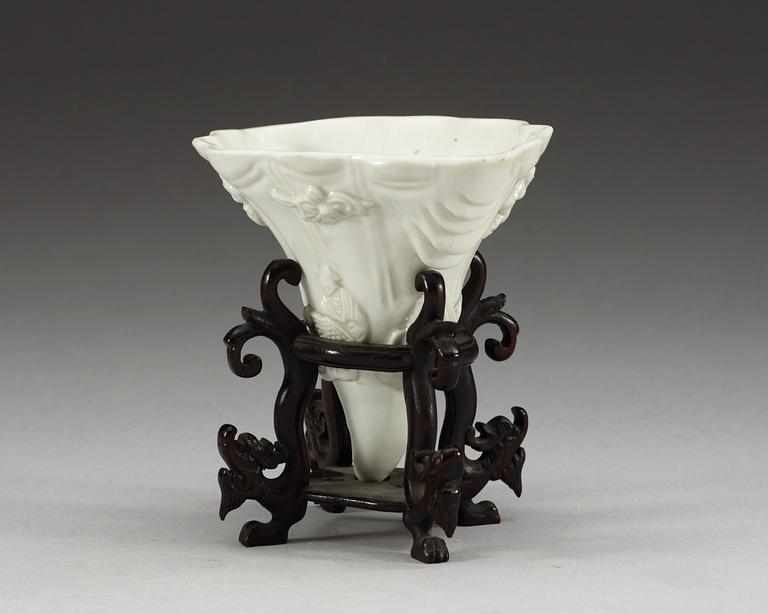 A blanc de chine libation cup in the shape of a rhinoseroushorn, Qing dynasty, Kangxi (1662-1722).