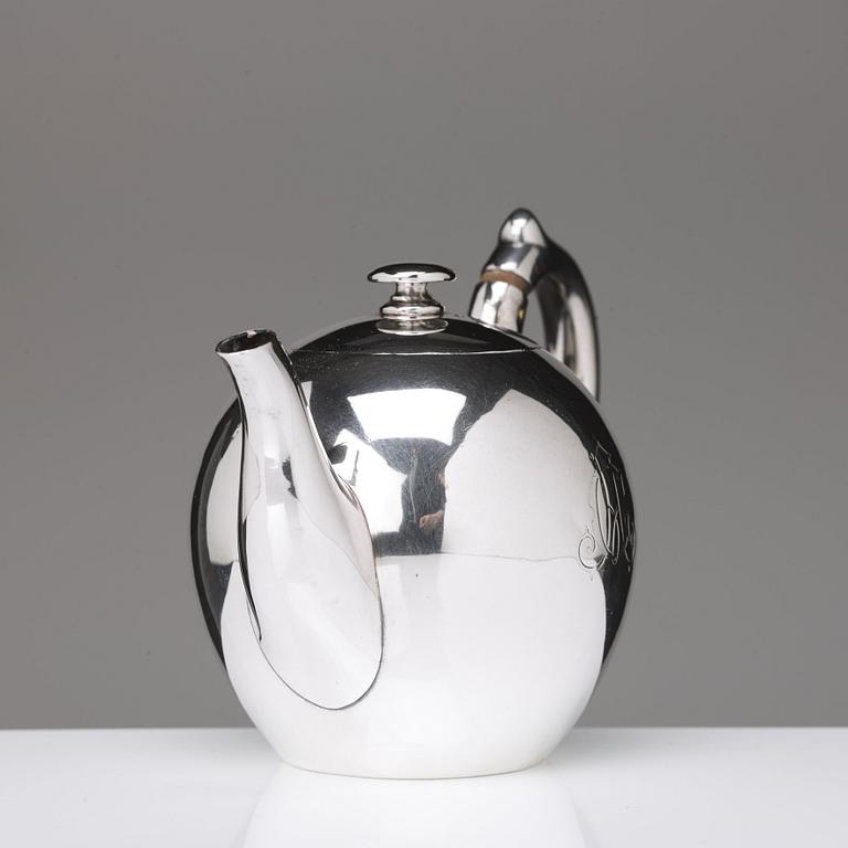 A German 20th century parcel-gilt silver tea-pot, marked Wilkens 875.