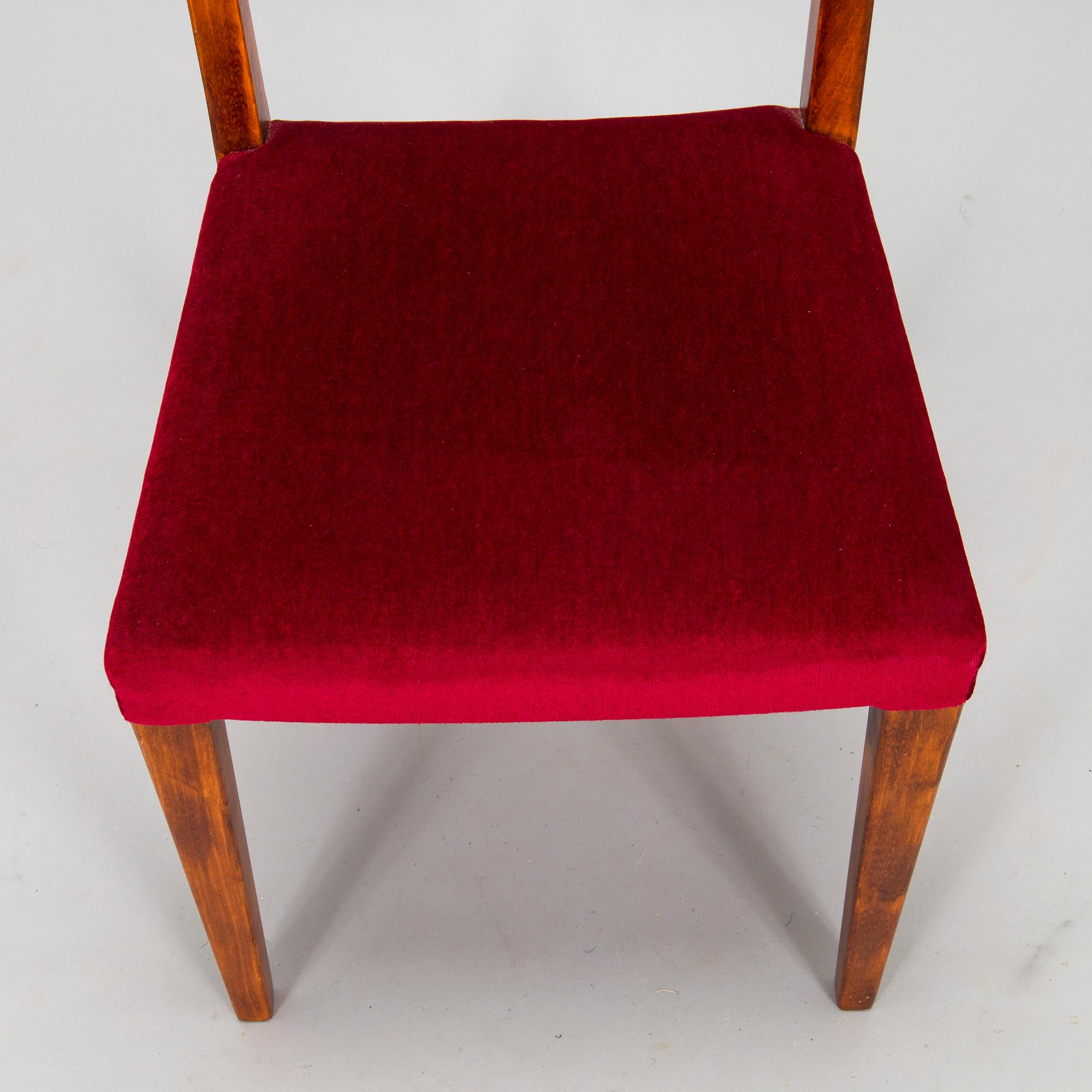 A mid 20th century dining table and a set of four chairs, Oy Boman Ab and two chairs Werner West.