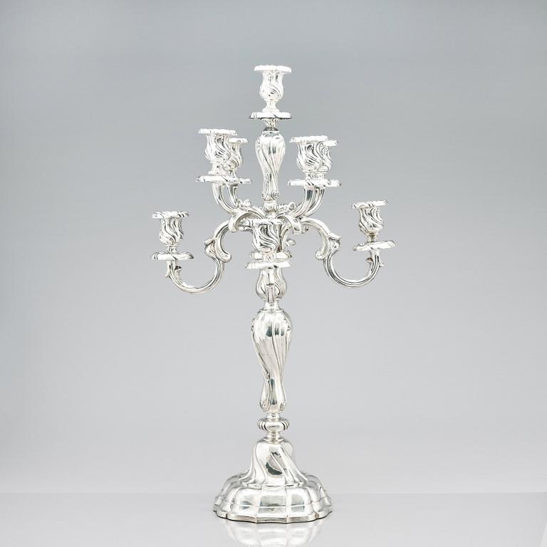 A pair of eight-light Louis XV-style silver candelabra, mark of Hermann Julius Wilm, Berlin, circa 1900.