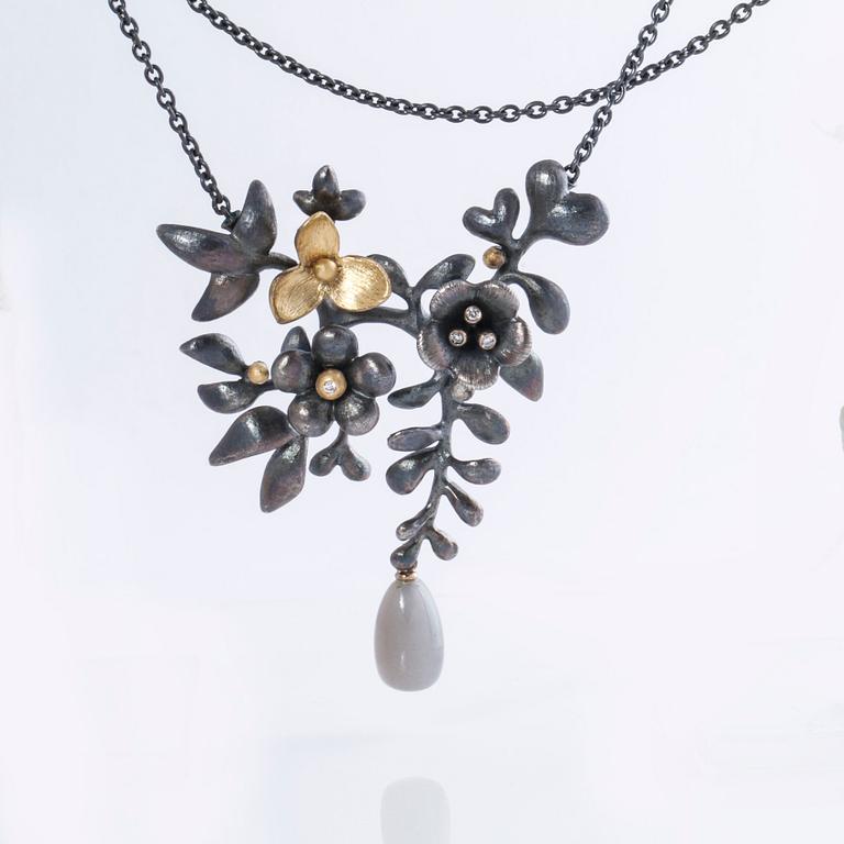 A moonstone and brilliant cut diamond necklace by Ole Lynggaard.