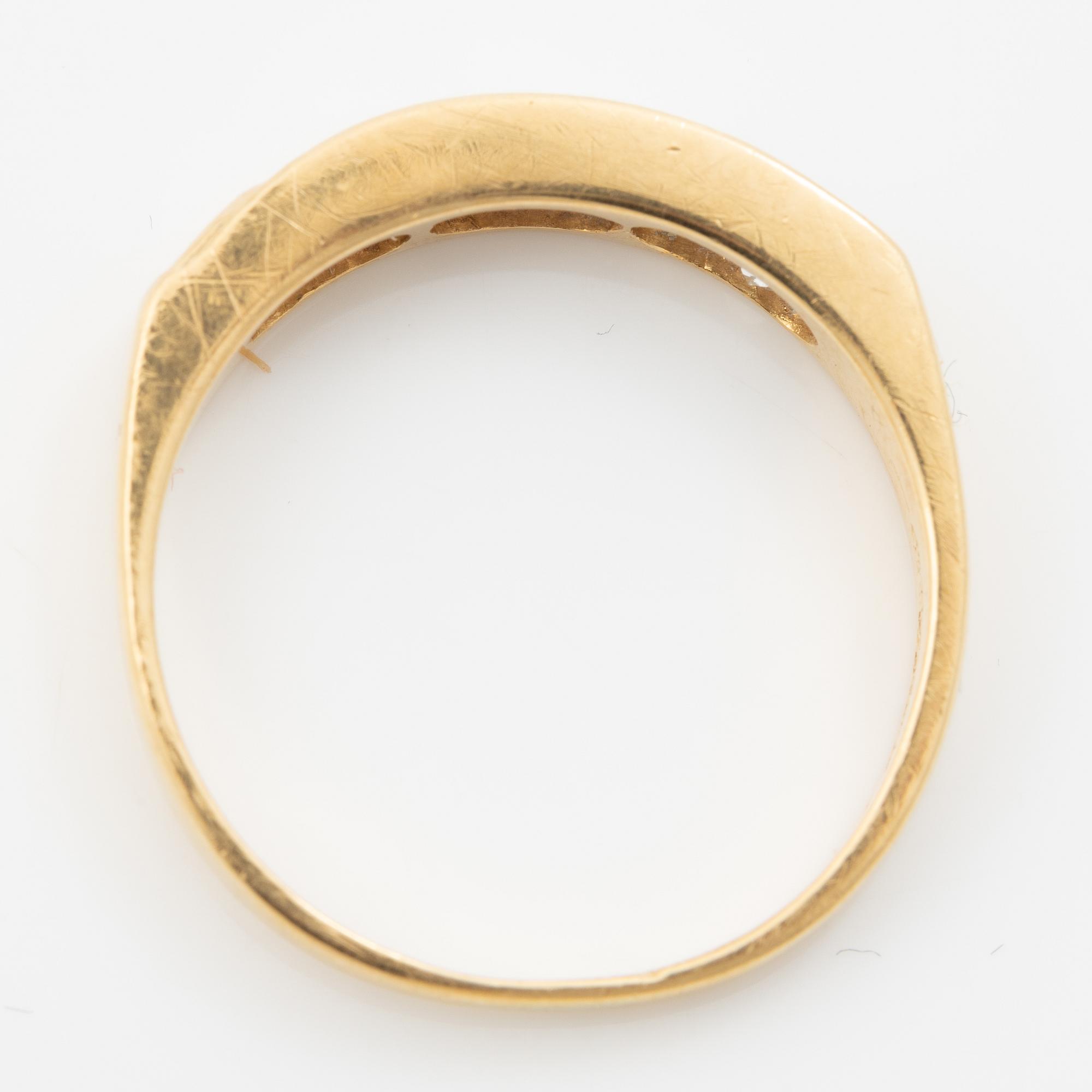14K gold ring with princess-cut diamonds.