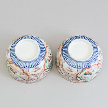 A pair of Japanese early 20th century porcelain bowls with covers.