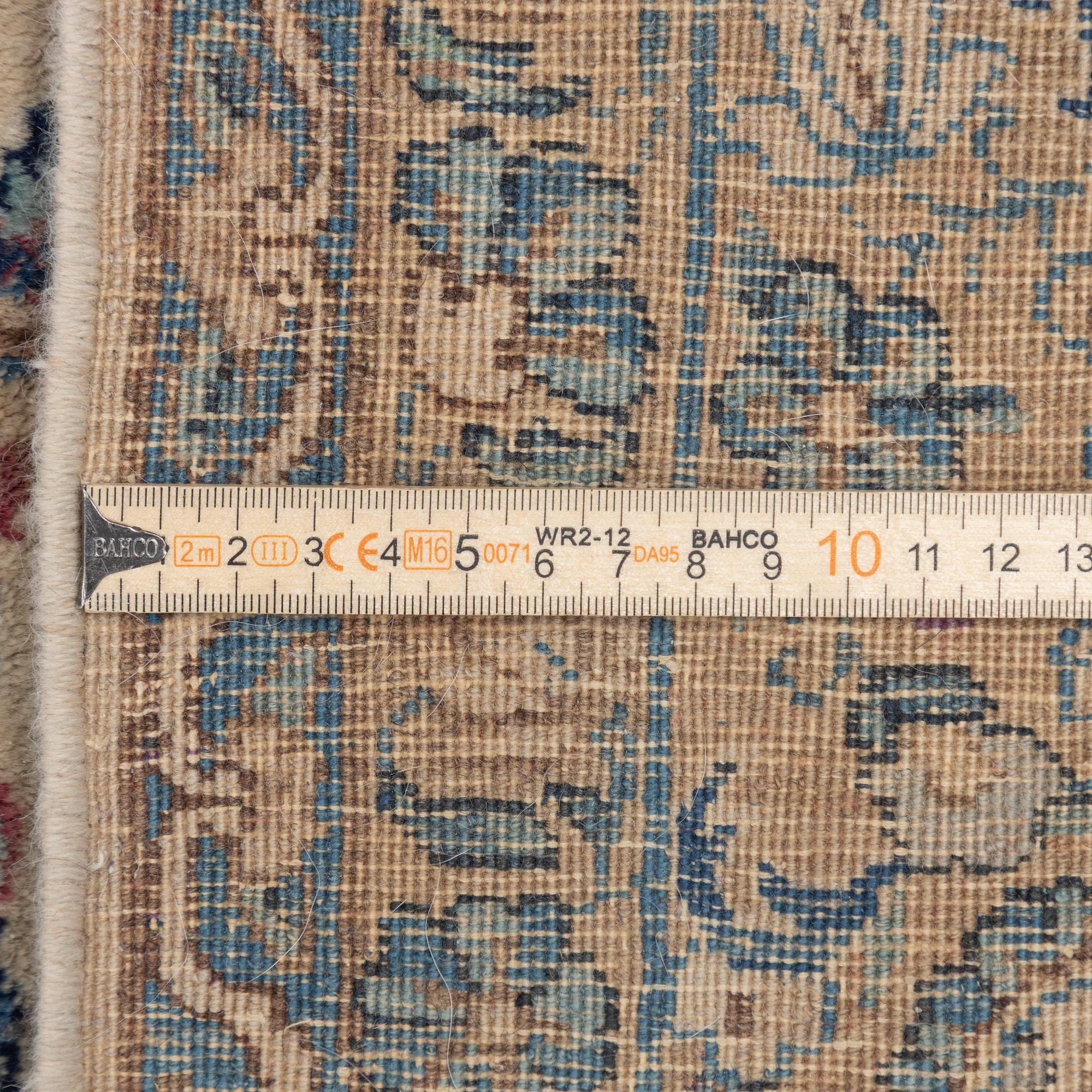 A semi-antique Kerman carpet, c. 273 x 172 cm.