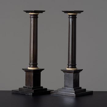 A pair of Empire early 19th century candlesticks.