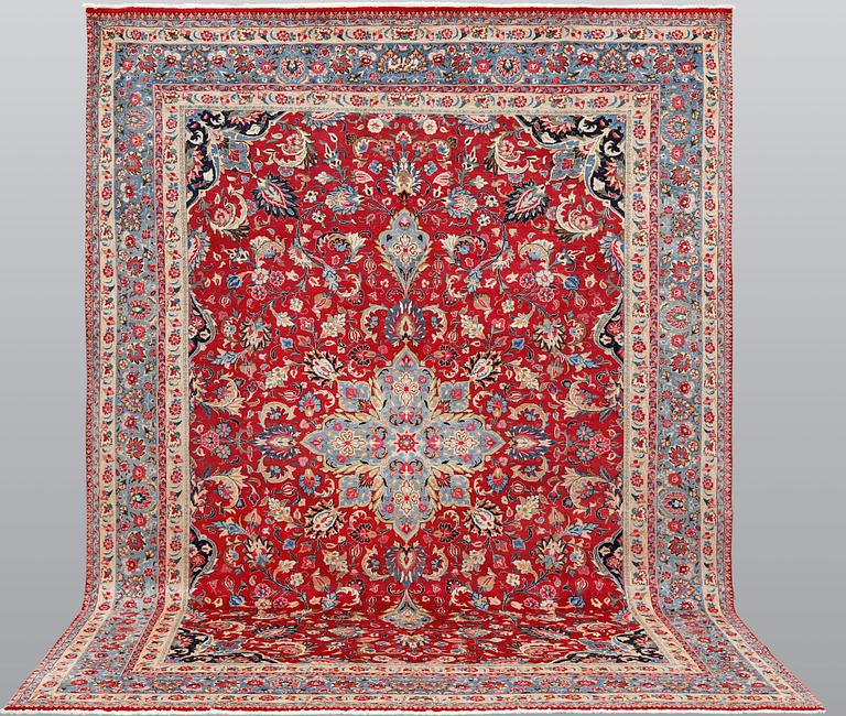 An old Meshed carpet, c. 342 x 252 cm.