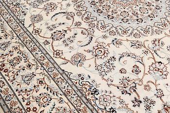 A Nain part-silk carpet, 395 x 293 cm.