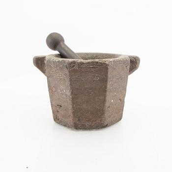 A Swddish 18th/19th century limestone and cast iron mortar.