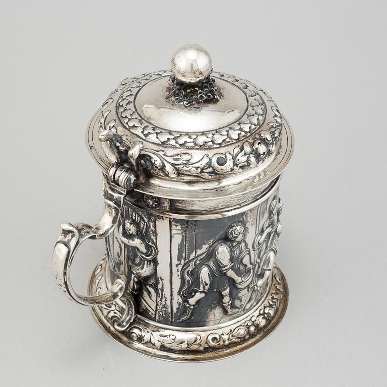 A silver baroque style tankard.