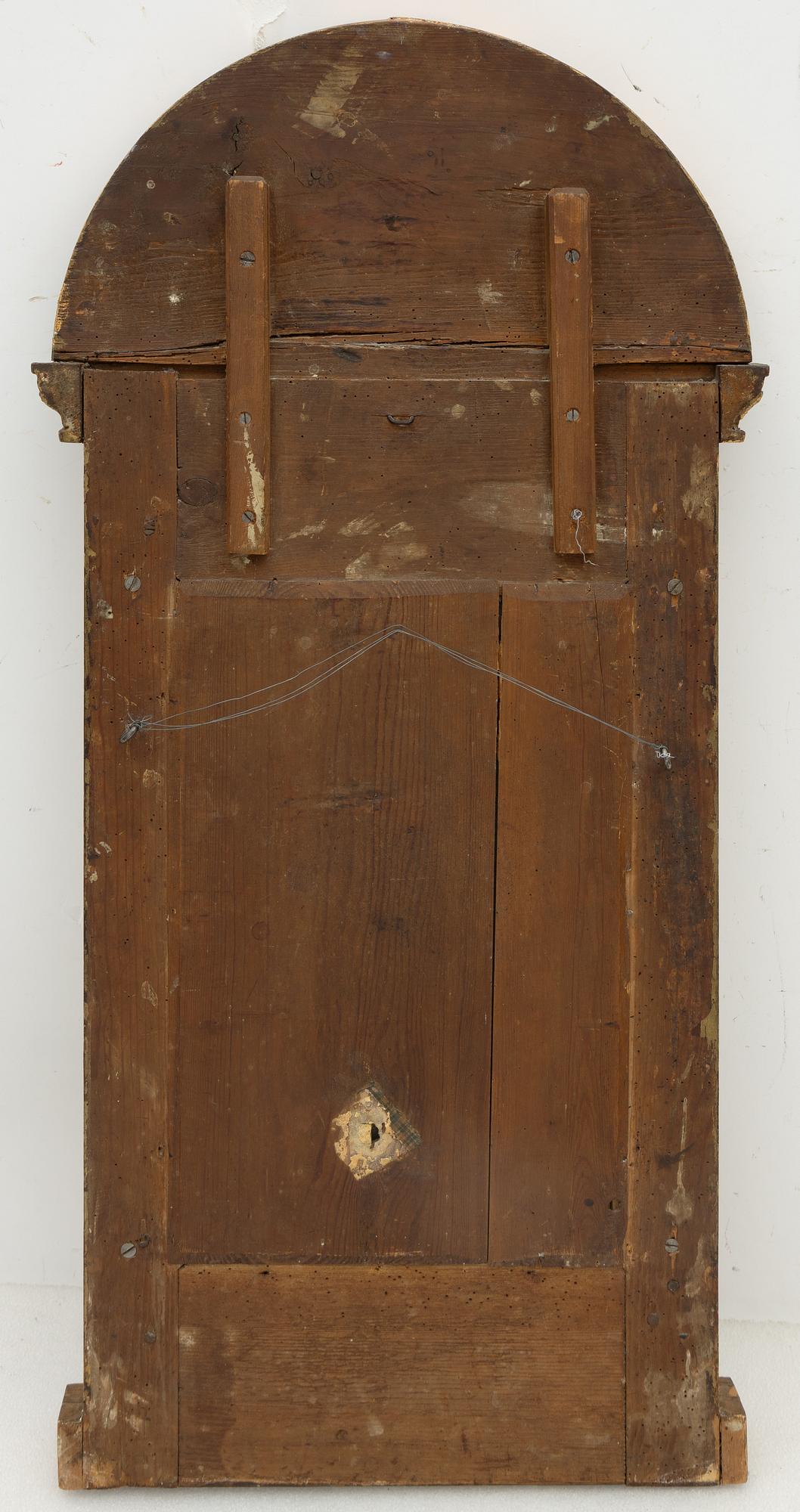 An Empire mirror, early 19th Century.