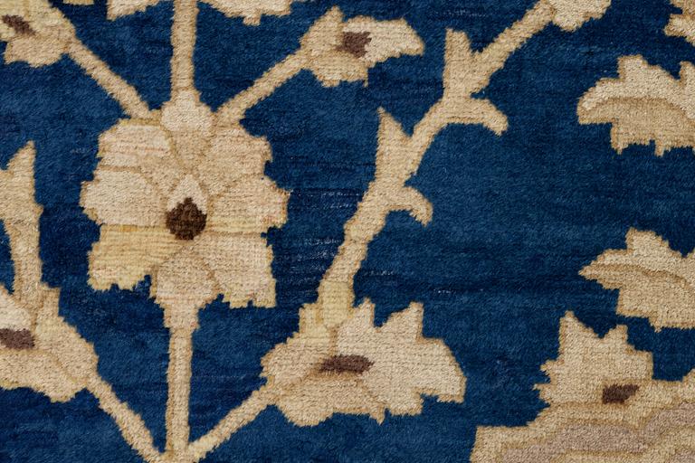 An antique Peking carpet, north China, c. 438 x 373 cm.