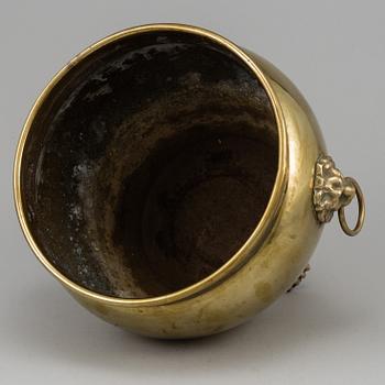 A 19th century brass champagne cooler.