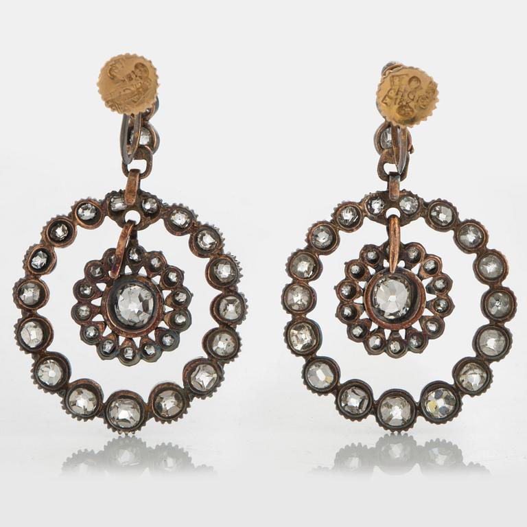 A pair of earrings set with old-cut diamonds with a total weight of ca 2.80 cts.