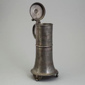 A PEWTER MUG, dated 1776.