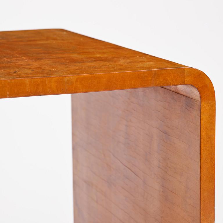 Swedish Modern, a birch veneered coffee table, 1930s-40s.