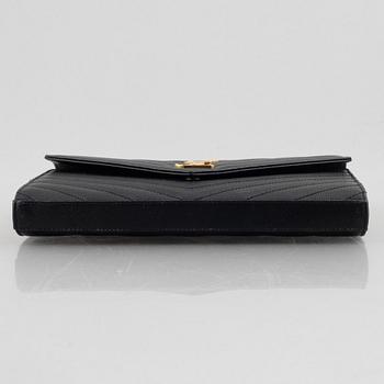 Yves Saint Laurent, a handbag/clutch.